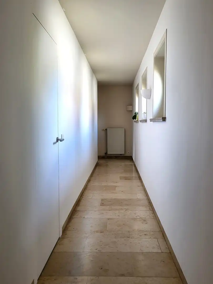 Exclusief wonen & ondernemen: imposante villa met volwaardige praktijk en aparte toegang op commerciële topligging, een perceel van 1.139 m² en met maar liefst 532 m² bewoonbare oppervlakte. foto 16