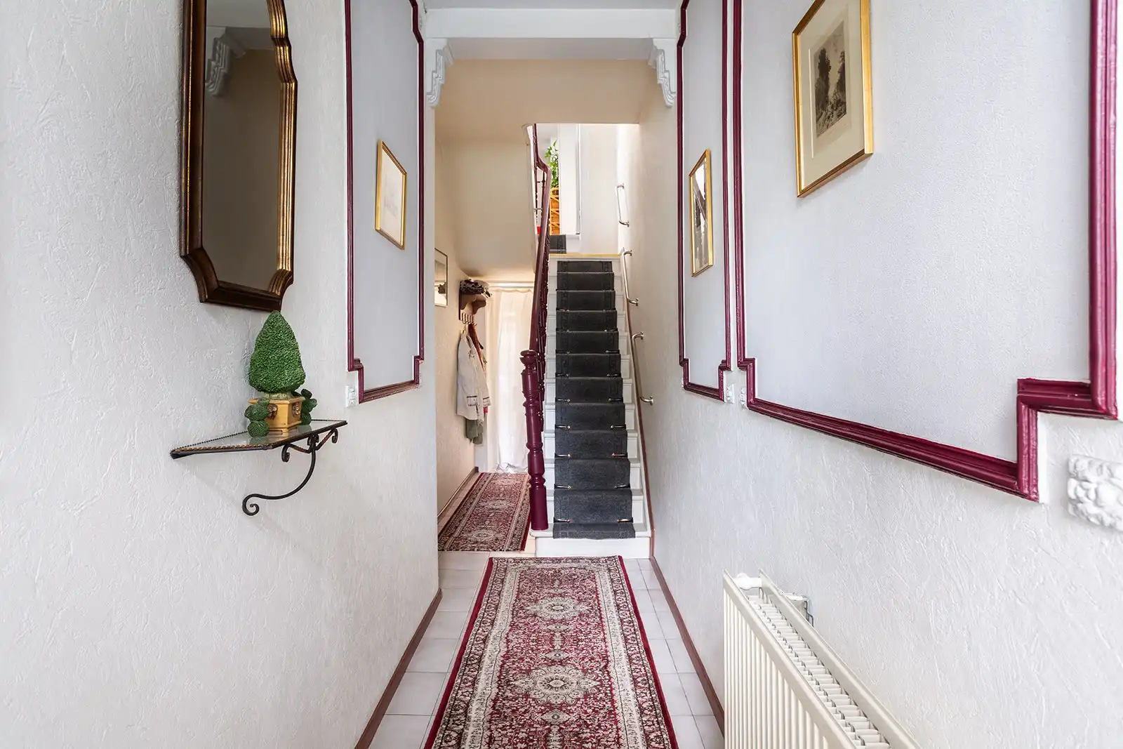 Woning met veel potentieel en zuidwestgerichte stadskoer  foto 3