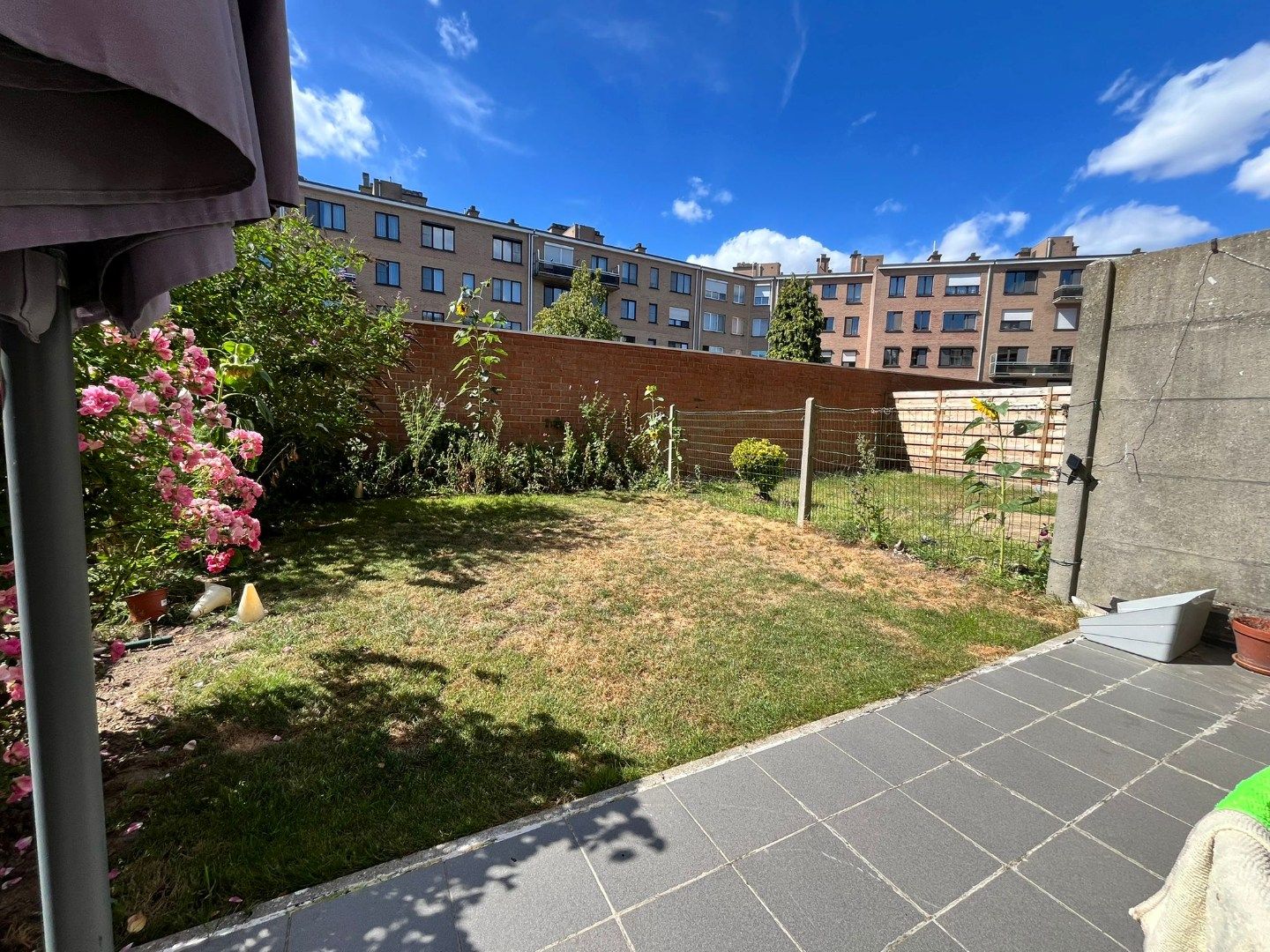 Gelijkvloers 2-slpk appartement met tuin en garage foto 16