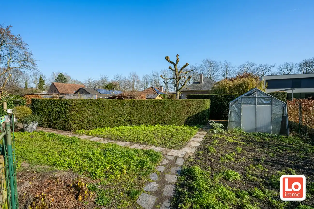 Degelijke open gelijkvloerse woning met inpandige garage en grote tuin op een groene toplocatie in Beervelde! foto 31
