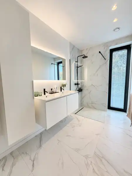 Luxueus designappartement met zuidterras, carport en ruime kelder foto 12