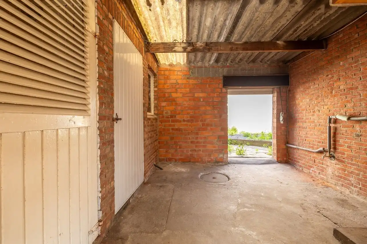 Karaktervolle woning met grote tuin, bijgebouwen en uitbreidbaar zoldervolume op een verrassend diep perceel foto 15