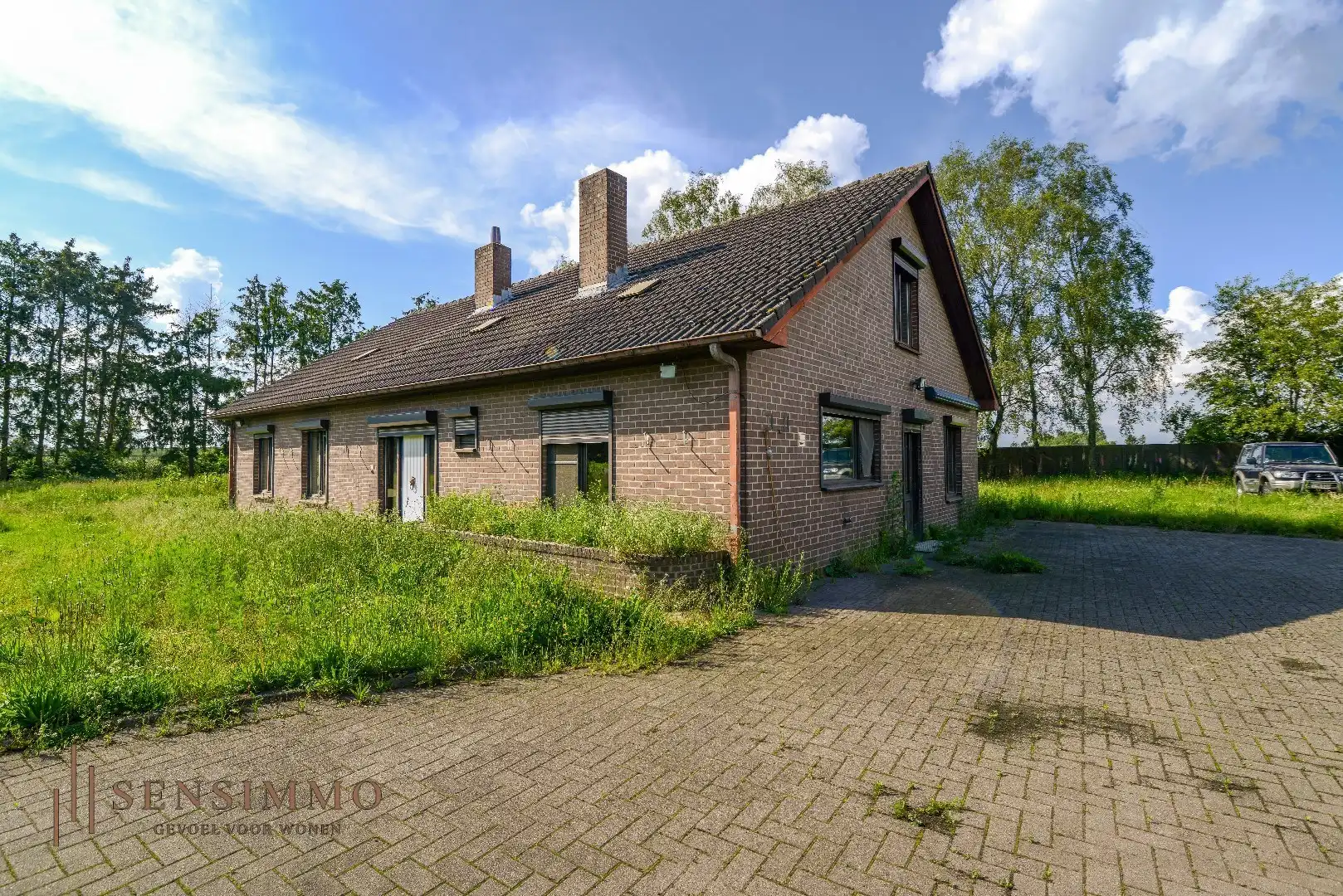 Hoofdfoto van de publicatie: Open bebouwing op ruim  perceel van 44 are met tuin, garage en 4 slaapkamers in Oudsbergen 