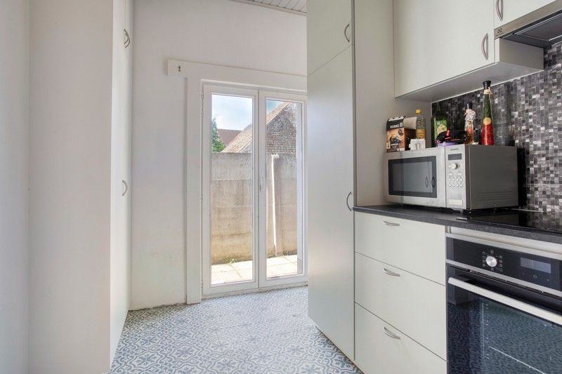 Gezellige woning met binnenkoer TE KOOP in het hart van Sint-Eloois-Vijve! foto 8