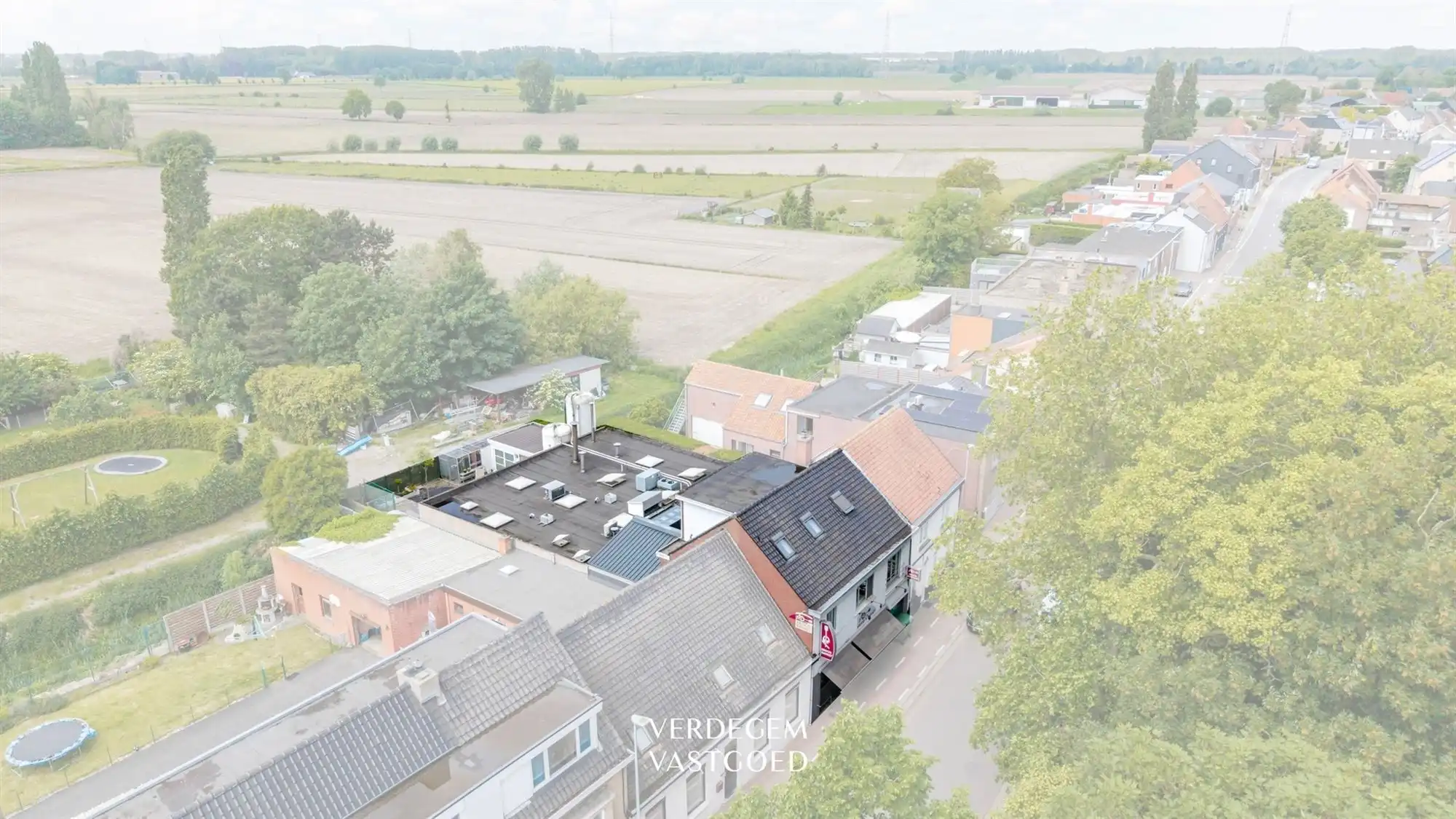 Hanselsruimte met woonst in het warm hart van Wippelgem foto 34