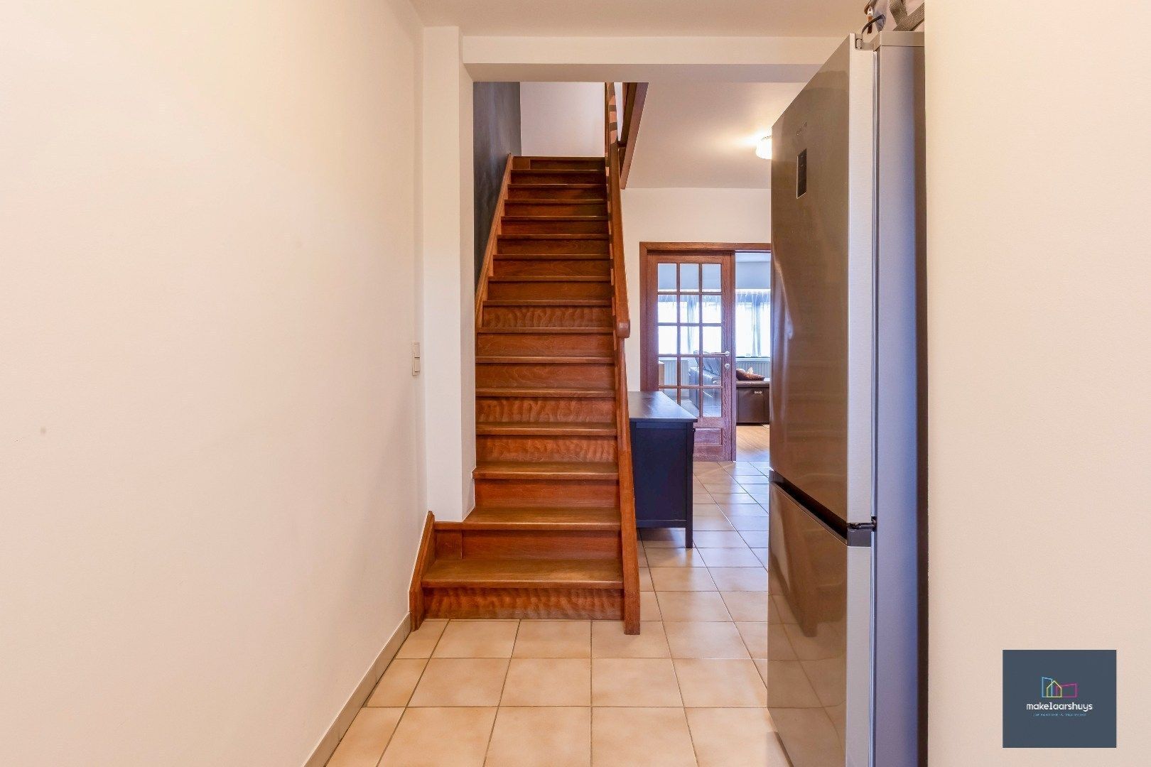 Heel ruime Instapklare woning in rij  met zonneterras en 2 staanplaatsen foto 14