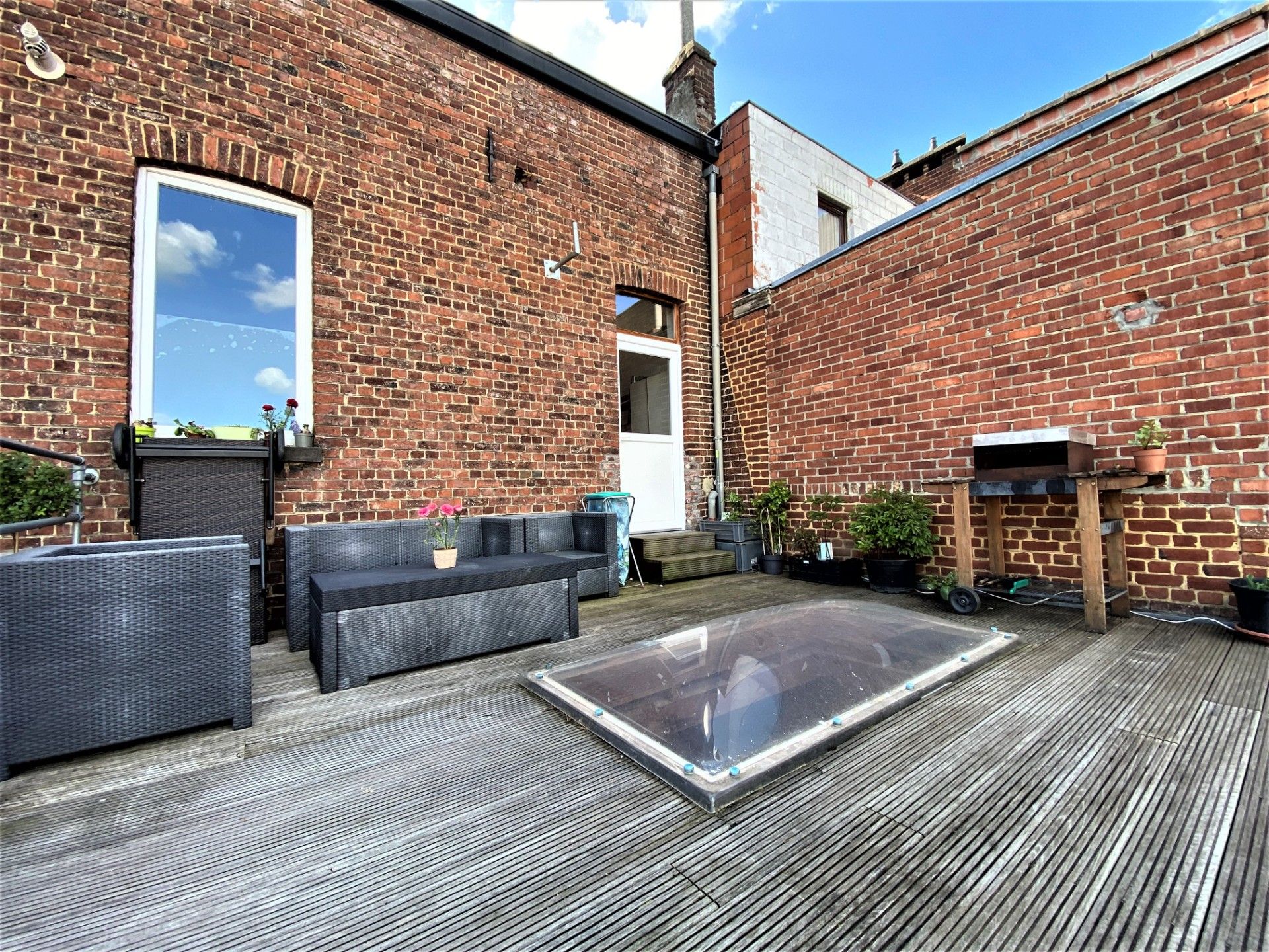 Leuke rijwoning met inpandige garage en zonnig terras in centrum Brakel foto 9