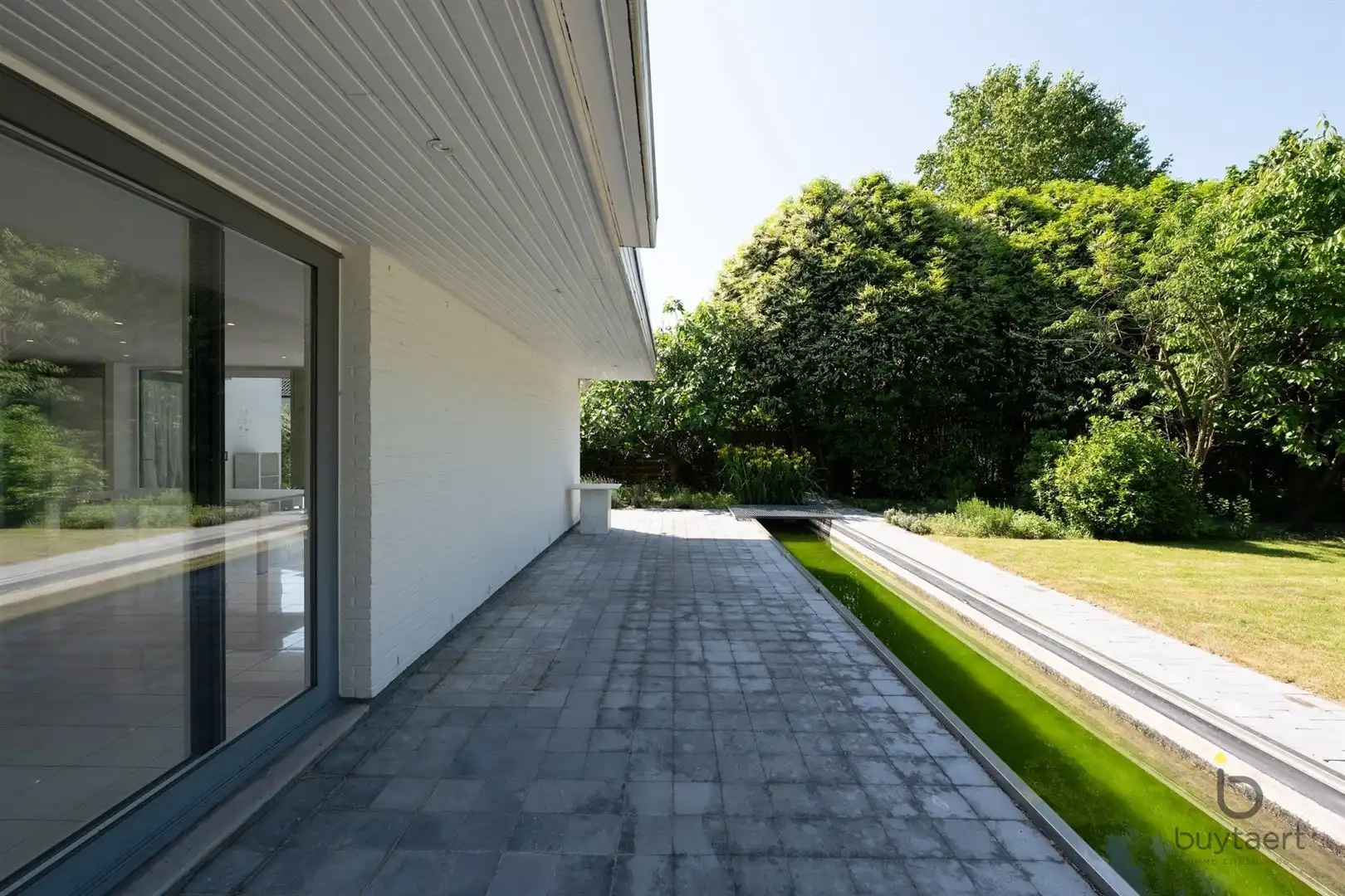 Te renoveren zonovergoten gelijkvloers 70’s woning met prachtige tuin en tal van mogelijkheden! foto 44