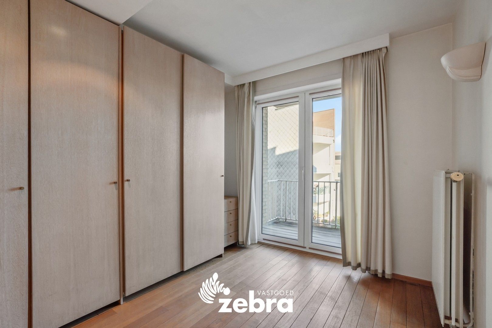 Instapklaar en lichtrijk appartement met 3 slaapkamers in het hart van Kortrijk, vlak bij de Grote Markt! foto 13