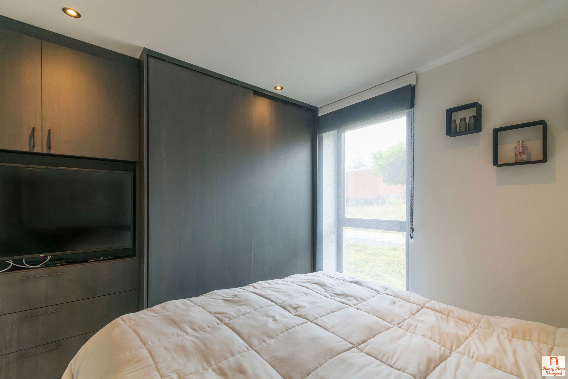 Ruimtelijk wonen met verfijnde afwerking in hartje Koersel foto 24