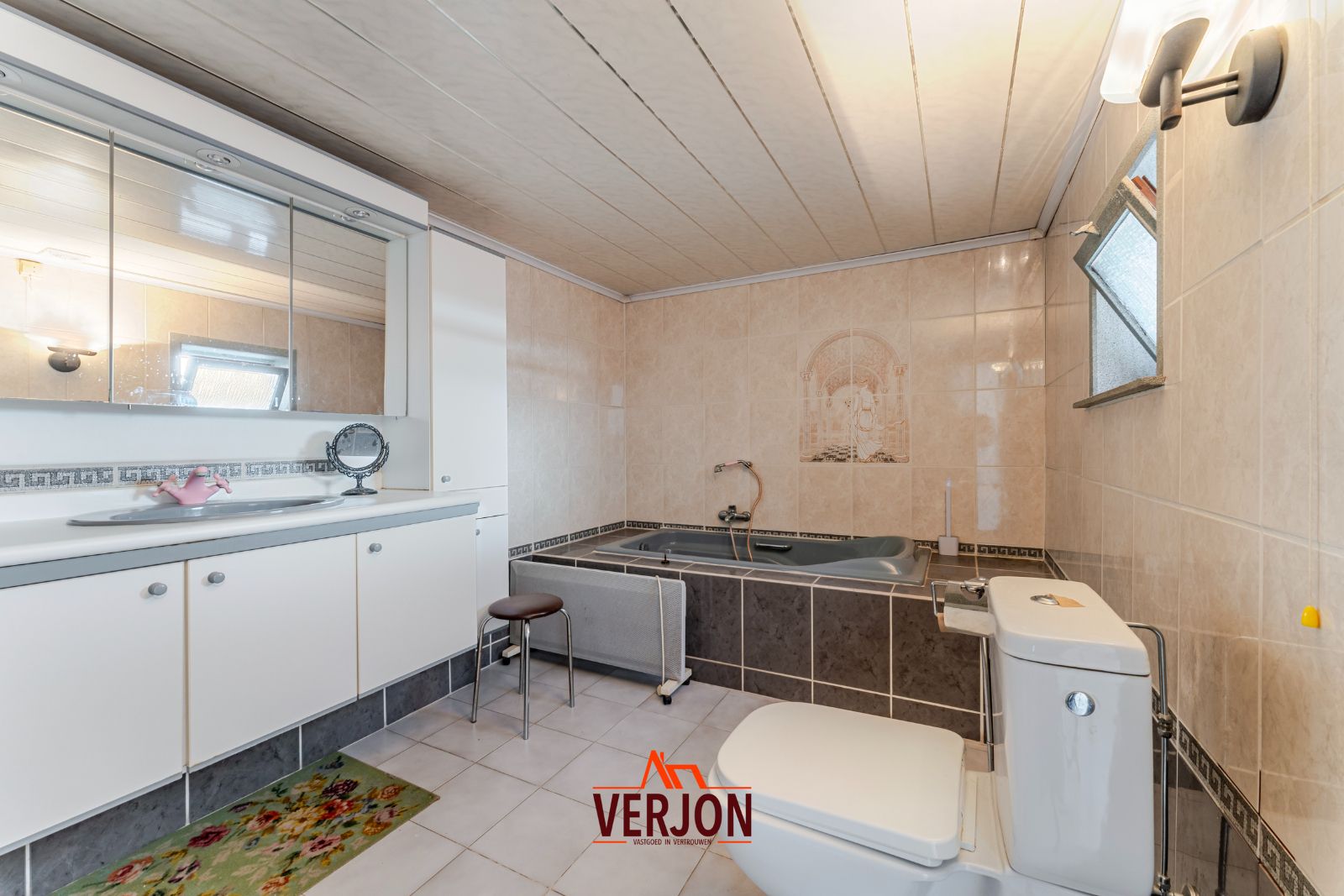 Charmante woning met ruime tuin te koop op het dorpsplein in Kachtem! foto 9
