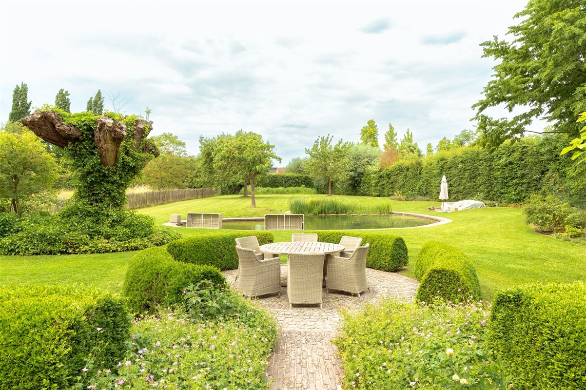 Charmante hoeve met loods en idyllische tuin te koop in Zwevegem foto 20