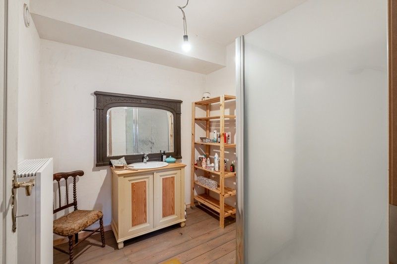 Handelsruimte met woonappartement in het centrum van Wommersom foto 18