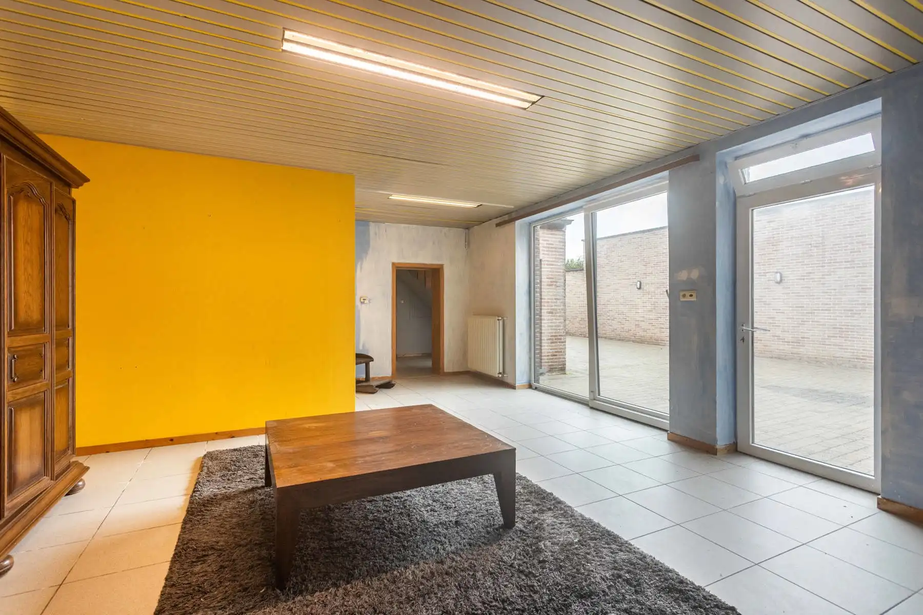 Polyvalente woning met tuin:  momenteel 2 appartementen garage en groot magazijn! foto 8