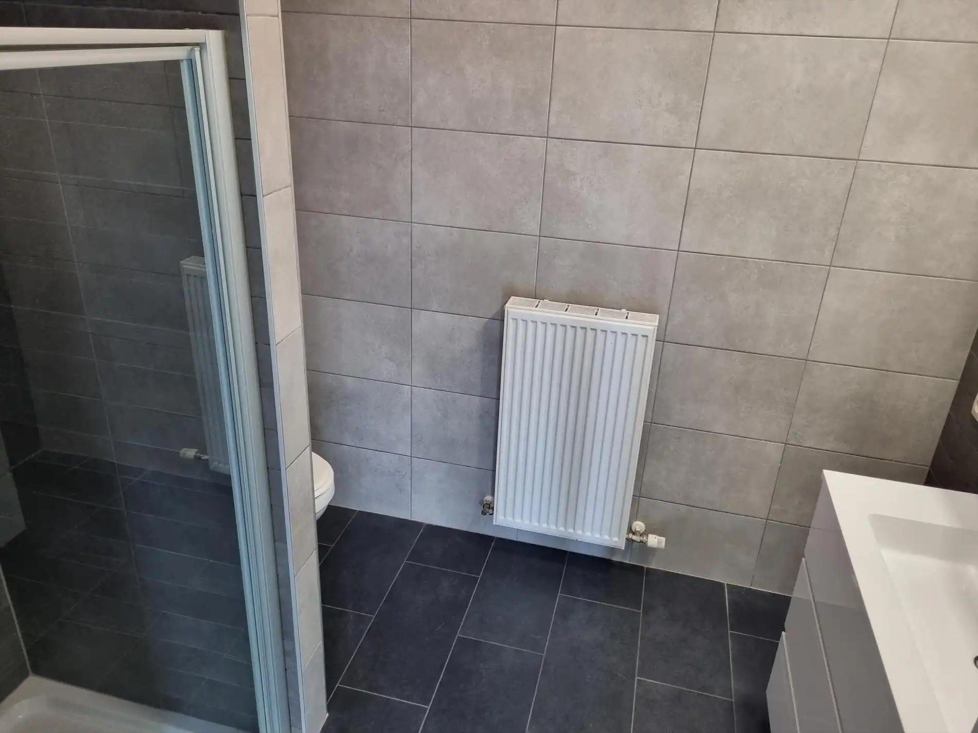 Knap gelijkvloers éénslaapkamerappartement met tuin en garagebox. foto 13