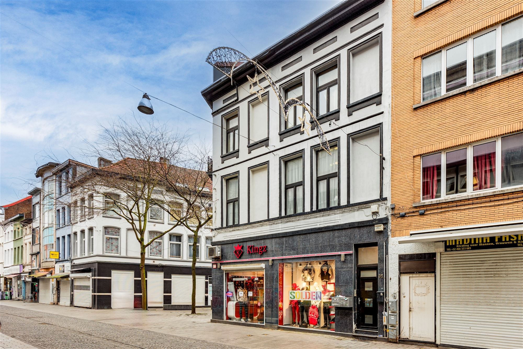 Hoekpand bestaande uit handelsglvl + 6 appartementen foto 4