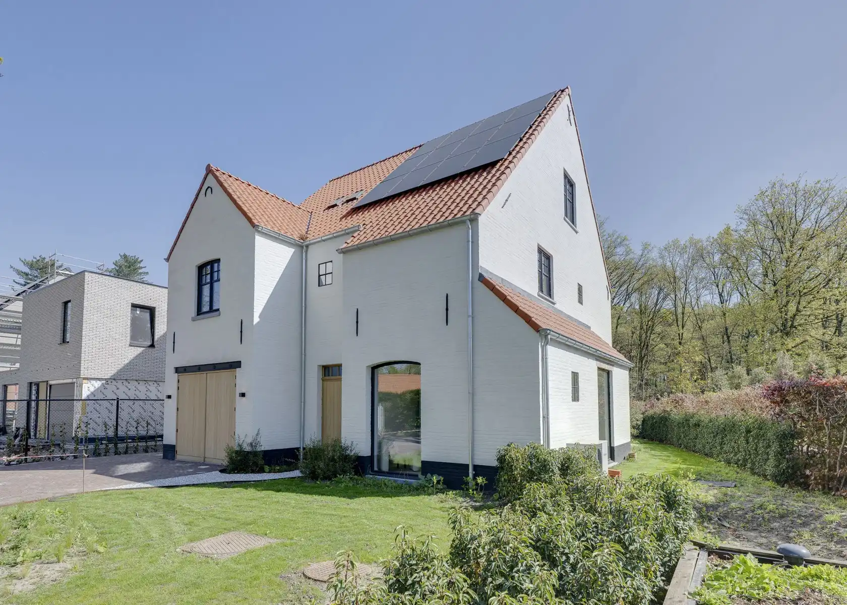 Stijlvolle nieuwbouwwoning met zicht op blijvend groen foto {{pictureIndex}}