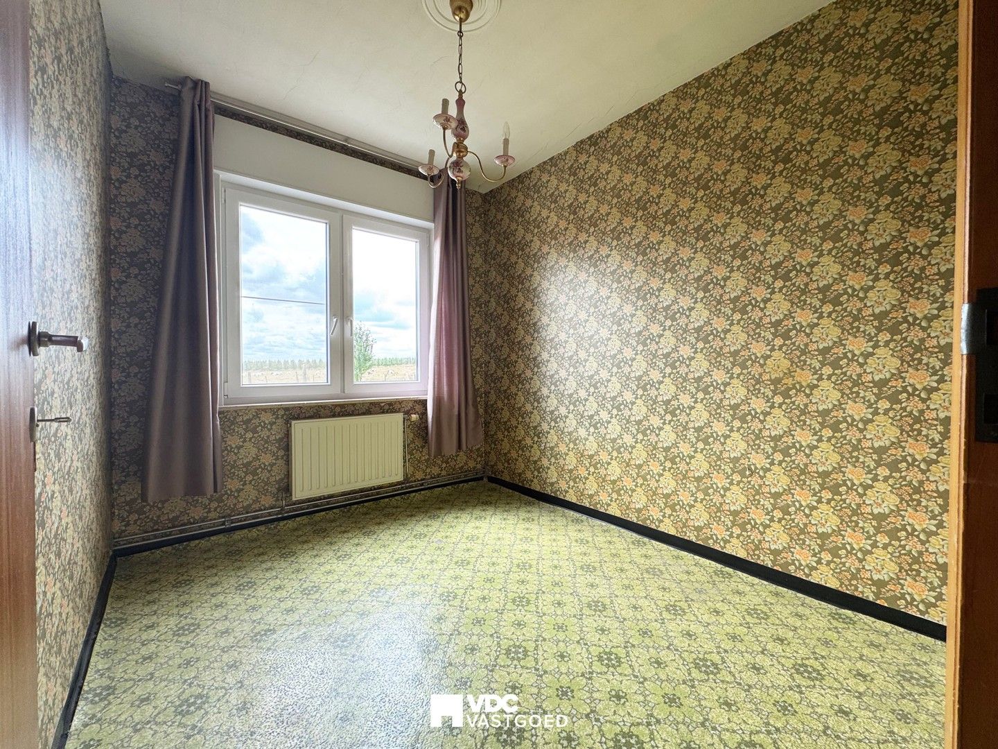 Te renoveren woning met uniek uitzicht op de velden foto 12