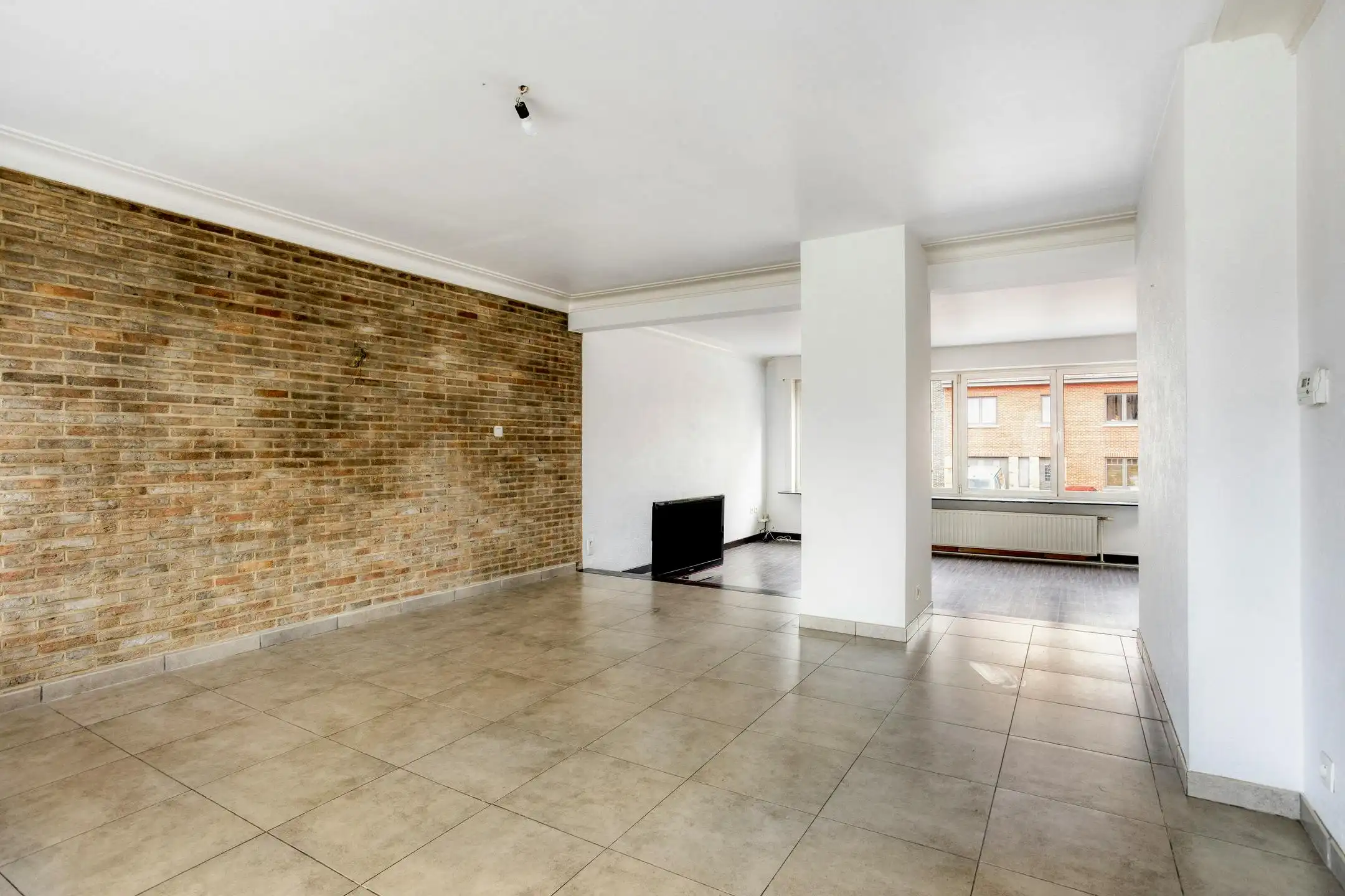 Driegevelwoning met extra studio/kantoor of praktijk, op een toplocatie in het centrum van Grimbergen! foto 3