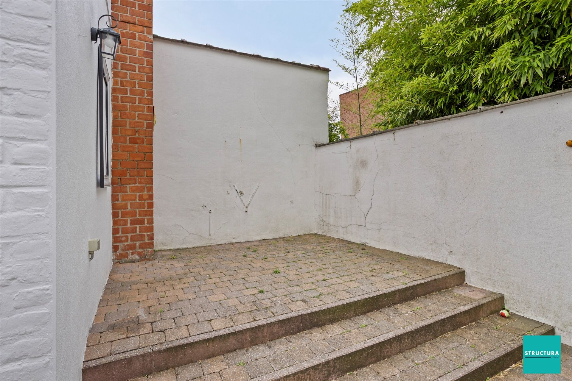 Instapklare rijwoning met stadskoer in hartje Merchtem foto 24