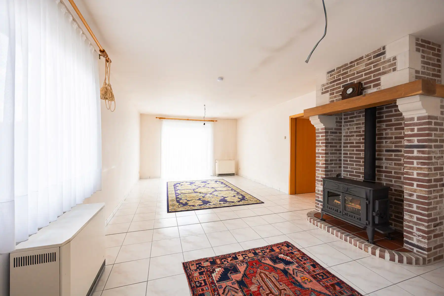 Gelijkvloerse open bebouwing met onderhoudsvriendelijke tuin foto 15