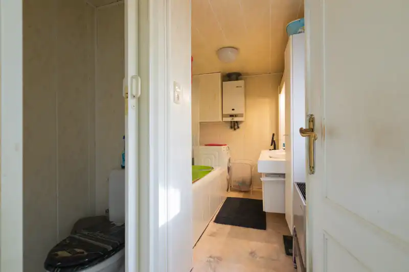 Rustig gelegen, te moderniseren woning met 3 slaapkamers (meer mogelijk), tuin en grote garage op 288m². foto 7