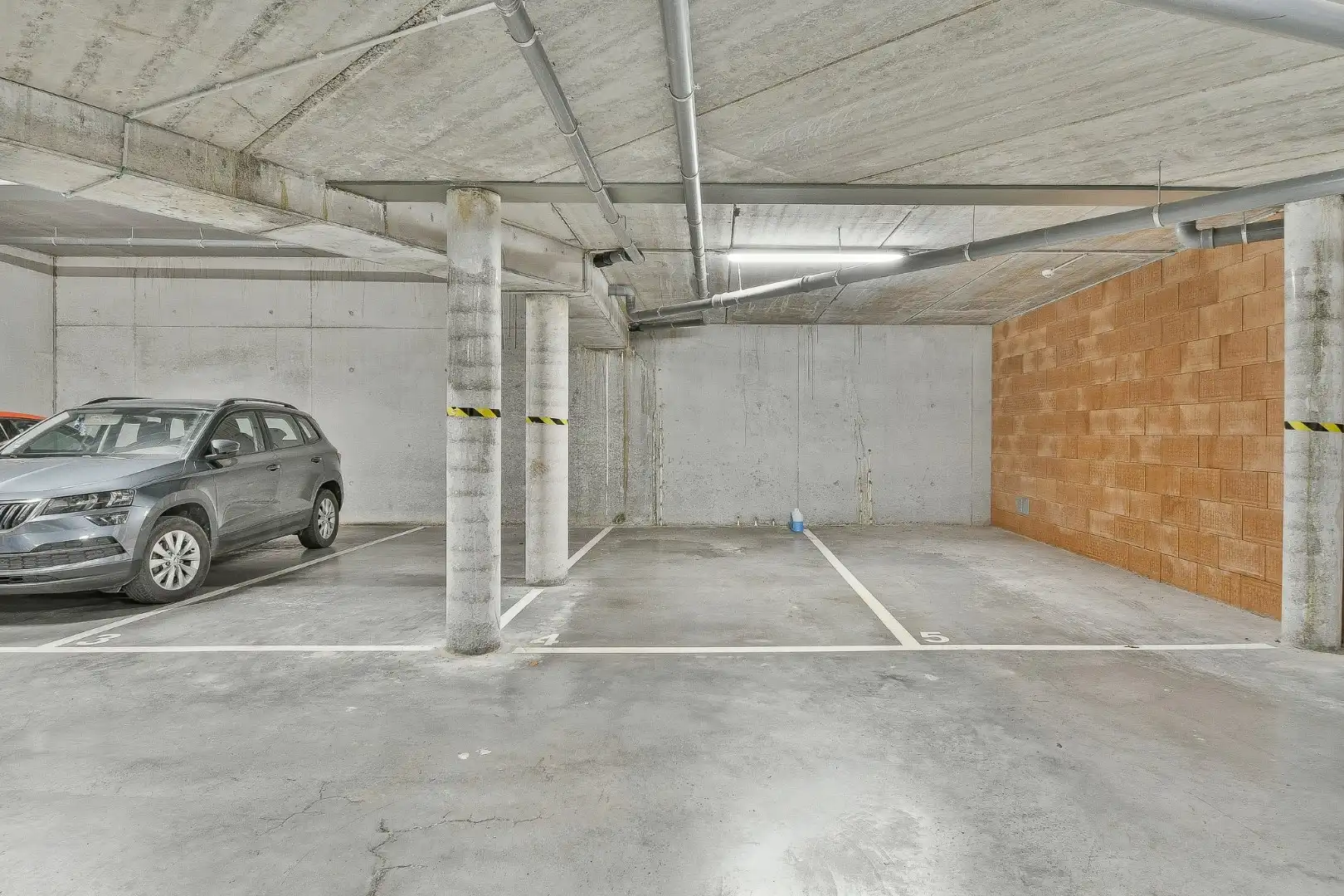 Ondergrondse parkeerplaatsen te koop in het centrum van Gistel foto 5