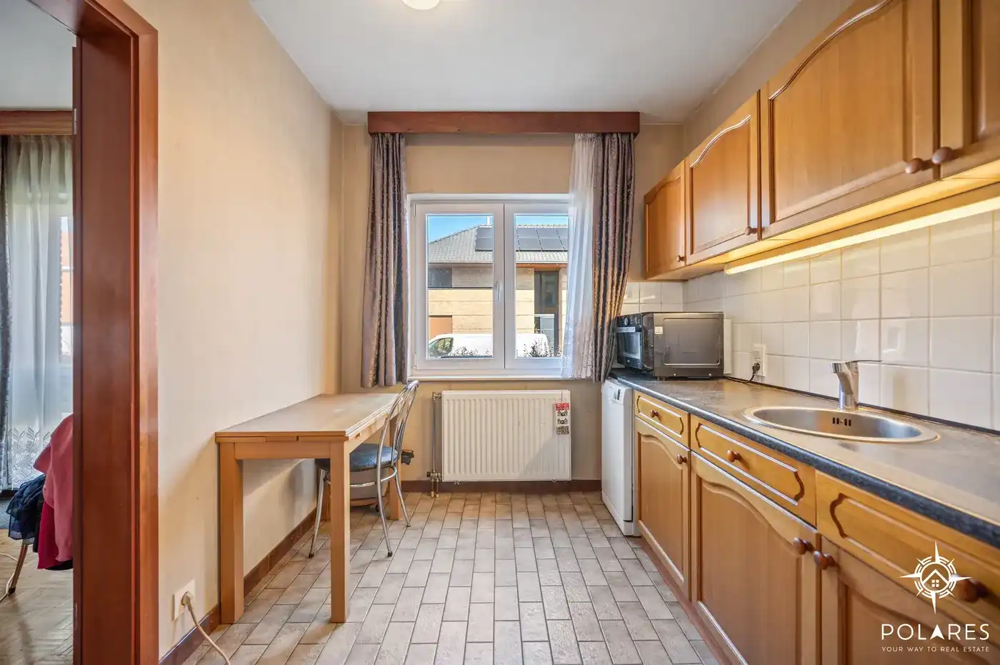 Ruim gelijkvloers appartement met 2 slaapkamers, garage en kelder foto 5
