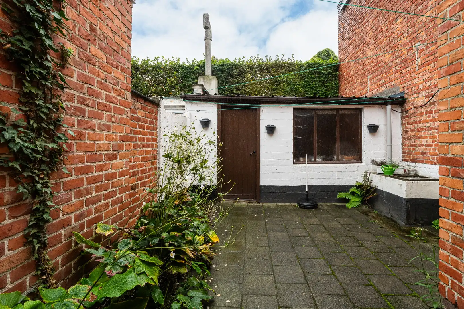 Te renoveren woning met verrassend veel ruimte, stadstuin en garagebox in Eeklo! foto 15