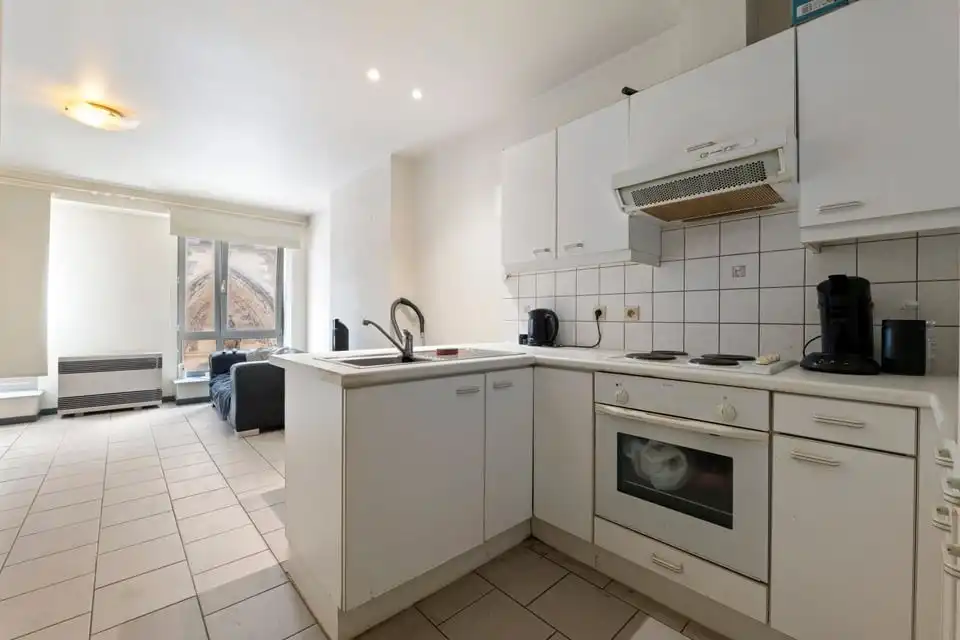 KNAP HANDELSPAND MET TWEE APART VERHUURDE APPARTEMENTEN IN HET CENTRUM VAN SINT-TRUIDEN foto 23