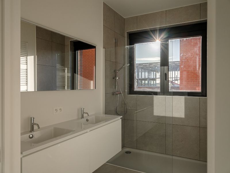 Ruim 2slpk-appartement met zuid-west georiënteerd terras aan de ‘Nieuwe Dokken’. Een appartement met een fenomenaal zicht over het water en de Gentse skyline! foto 10