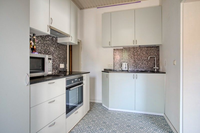 Gezellige woning met binnenkoer TE KOOP in het hart van Sint-Eloois-Vijve! foto 4