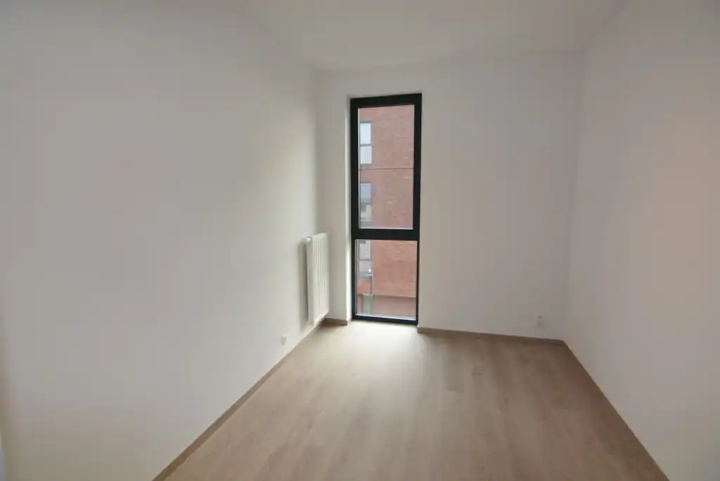 Modern, energiezuinig appartement met 2 slpks, terras, autostaanplaats en kelderberging. foto 16