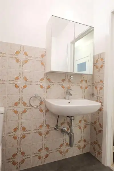 Centraal gelegen gelijkvloers 2-slaapkamerappartement — ideaal als starter of opbrengsteigendom foto 15
