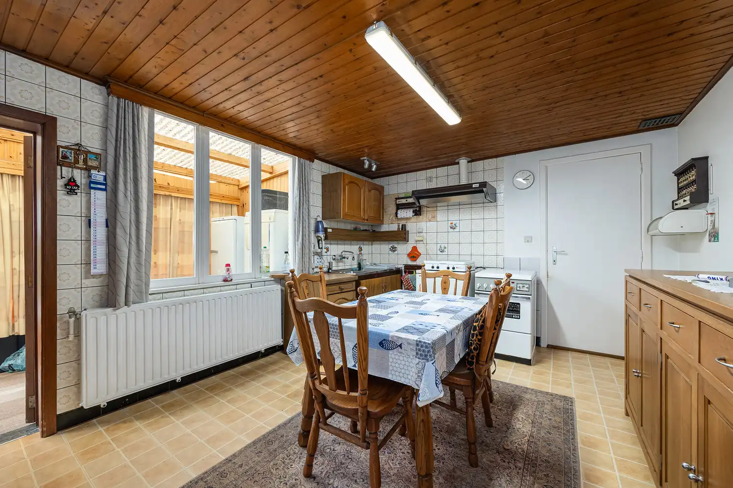 Halfopen woning op 575 m² met garage, carport en diepe tuin – te renoveren foto 10