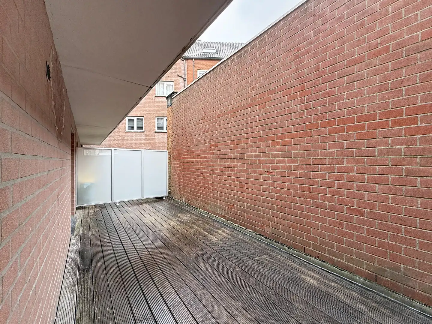 2 slaapkamer appartement met koer en garagestaanplaats foto 10