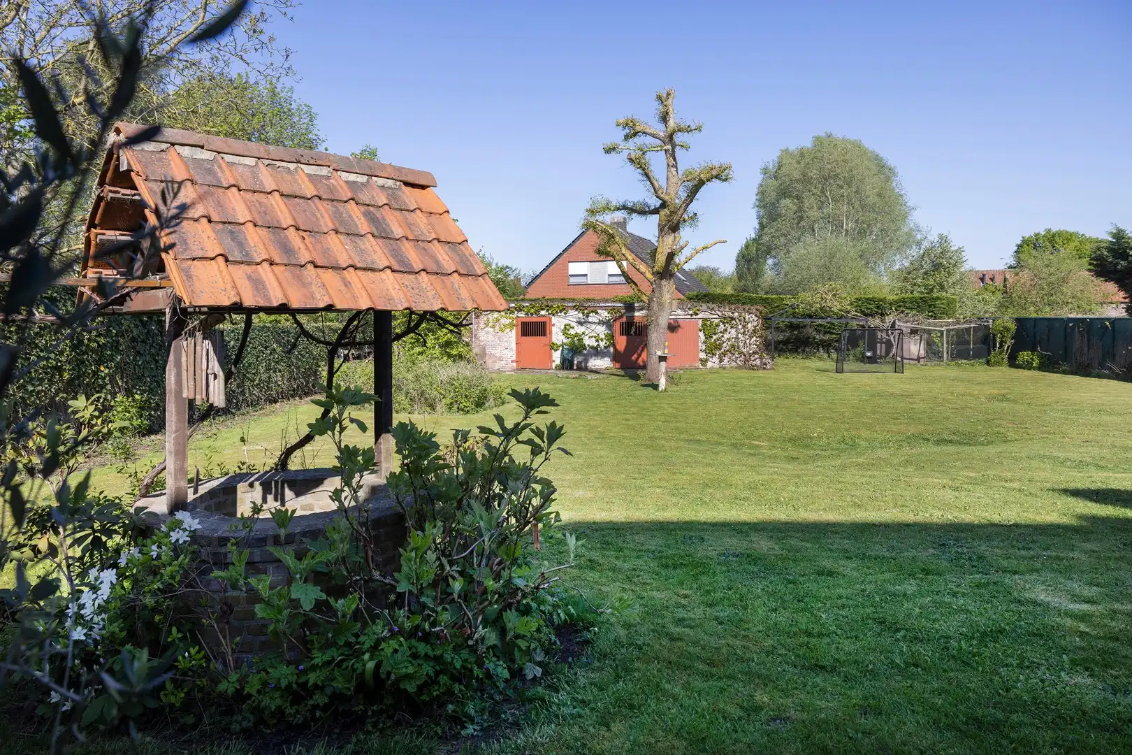 Ruime alleenstaande woning met grote tuin en veel privacy. foto 23