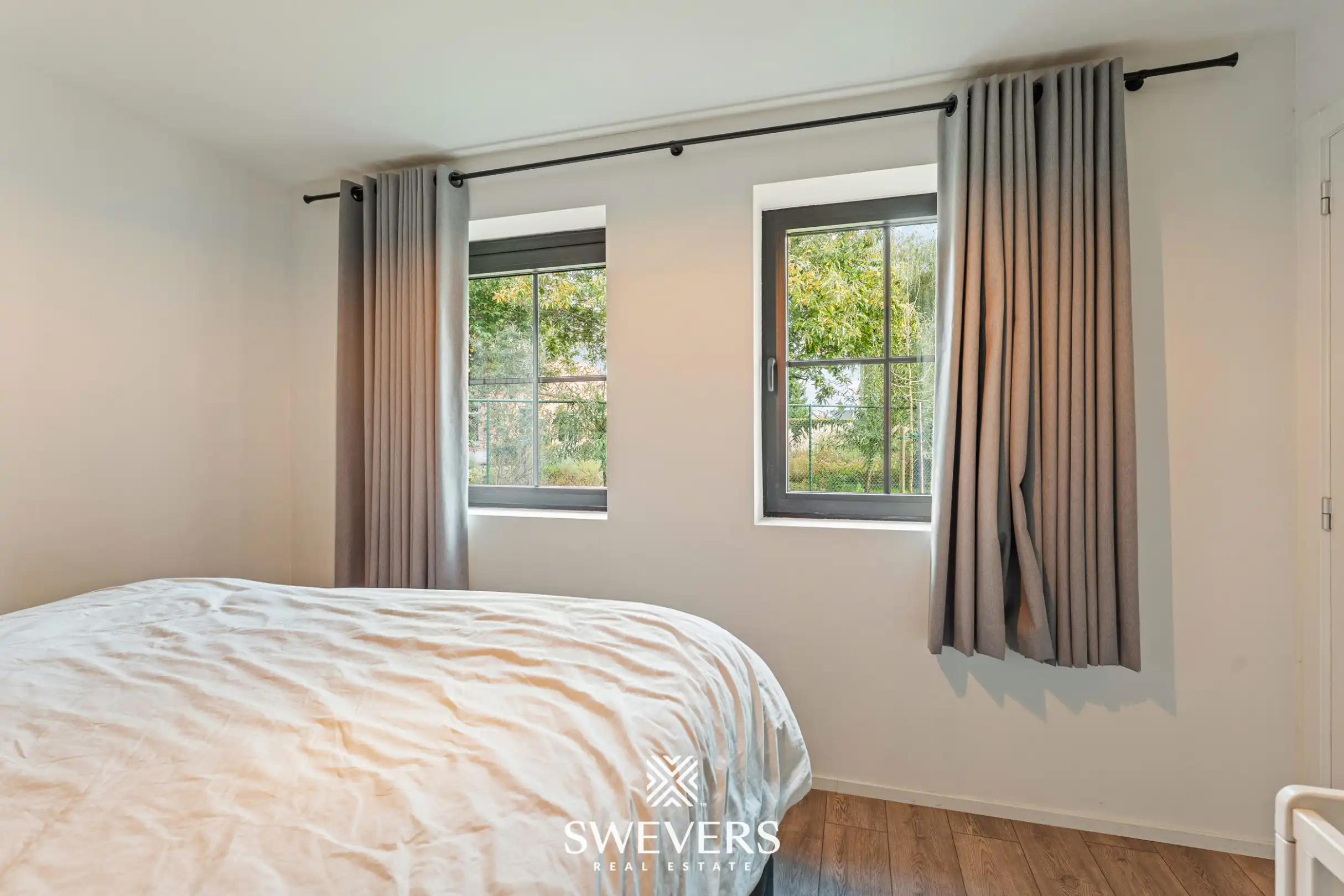 Instapklaar gelijkvloers 2 slpk-appartement met terras en tuin in Heusden. foto 16