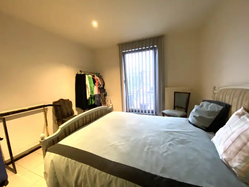 Verzorgd appartement met terras, parkeerplaats en private berging – interessante opbrengsteigendom foto 5