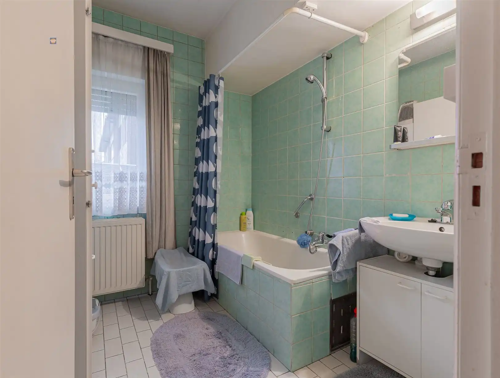 Gelijkvloers 2-slaapkamerappartement met tuin en garage foto 8