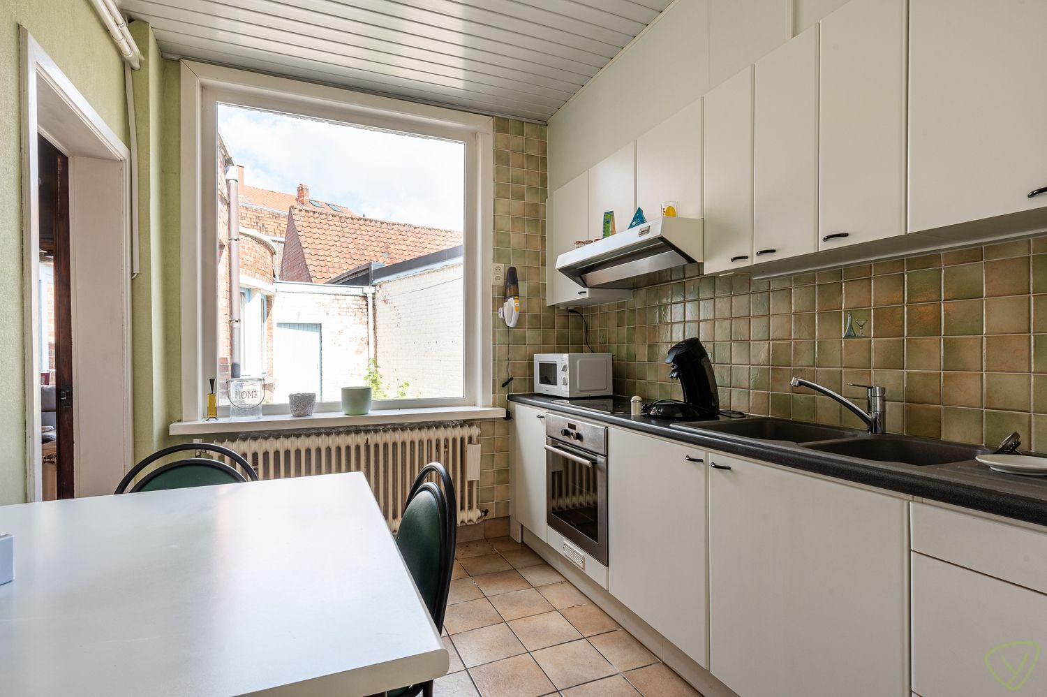 Woning met winkelruimte te koop in het centrum van Ursel foto 3