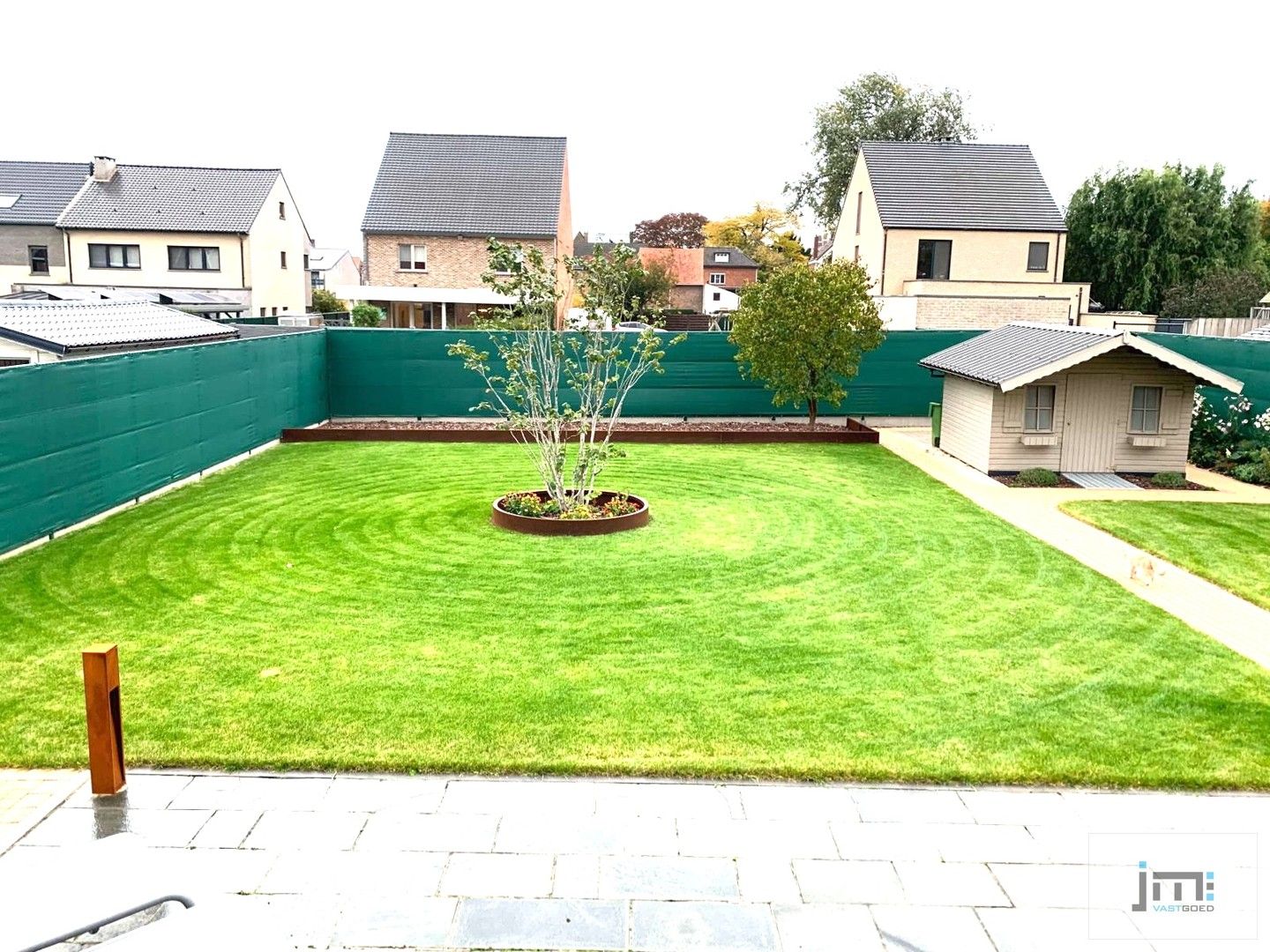 Ruime open bebouwing met tuin en garage foto 18