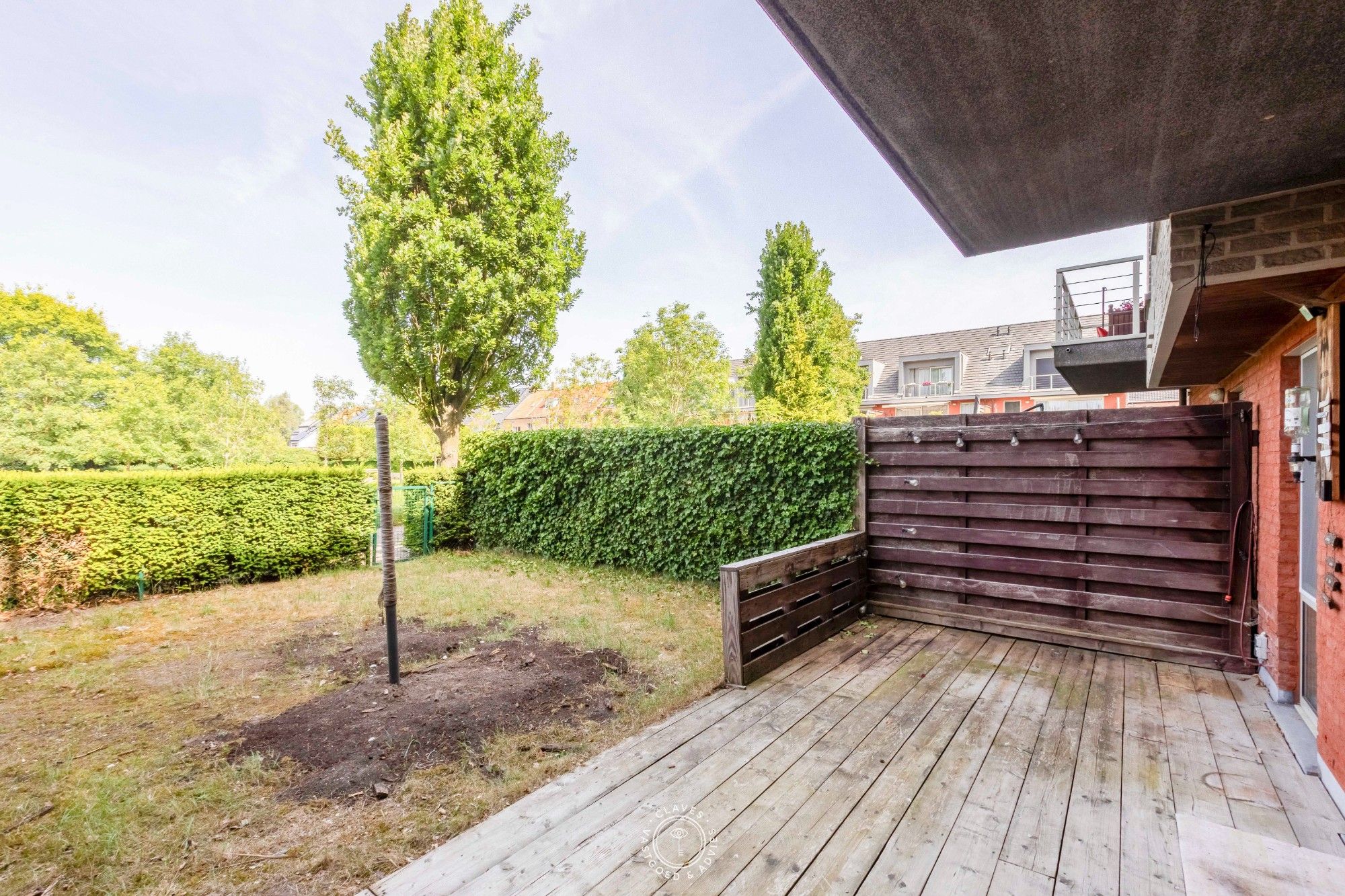 Gelijkvloers appartement met ruim terras en tuintje op een gesloten en groene residentie. foto 12