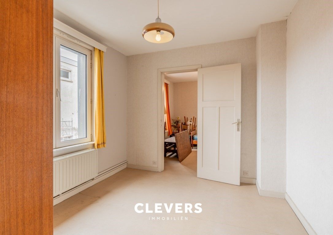 Opbrengsteigendom met lopende handelshuur + 2 appartementen foto 8