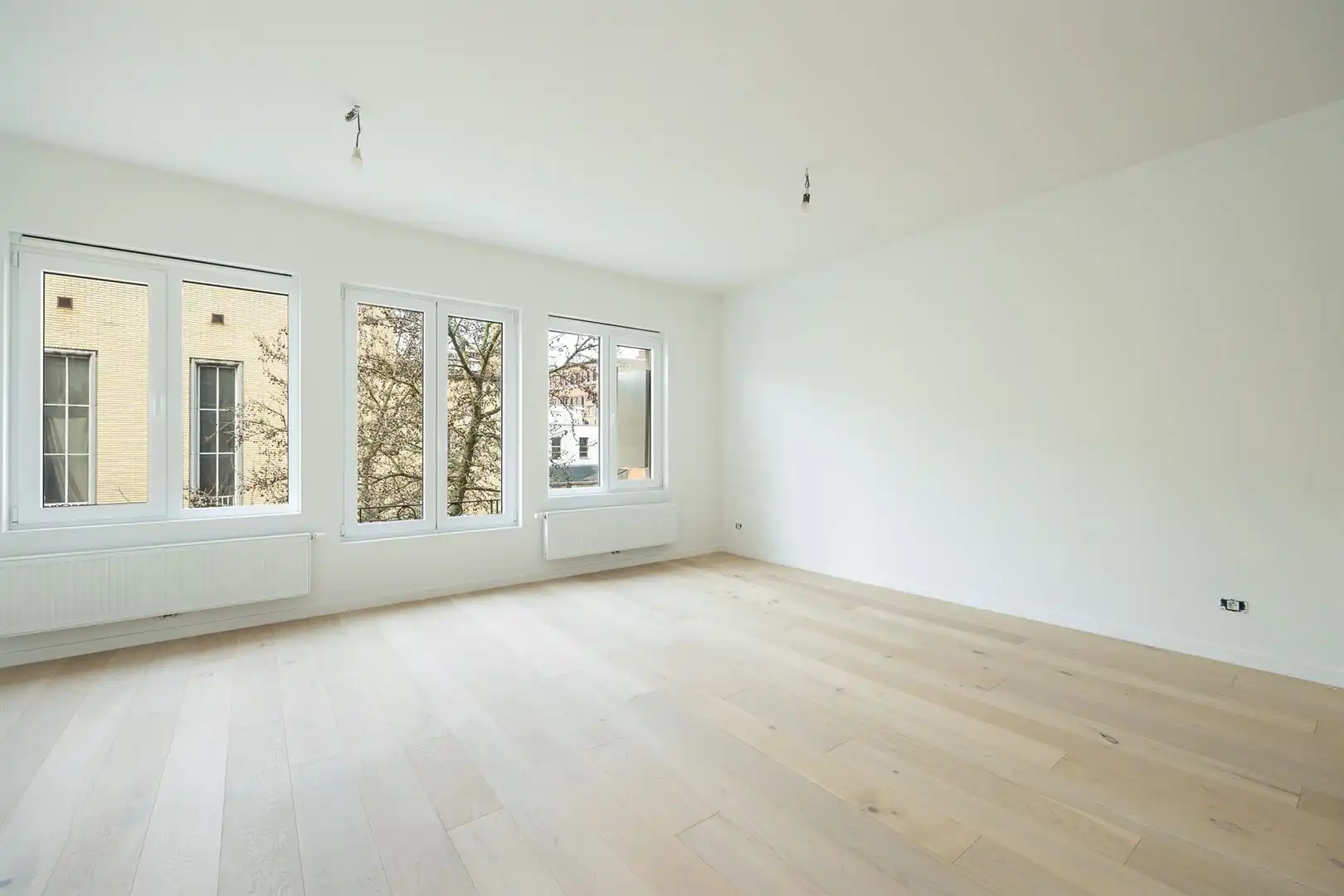 Ruim en licht 2-slaapkamerappartement met dakterras foto {{pictureIndex}}