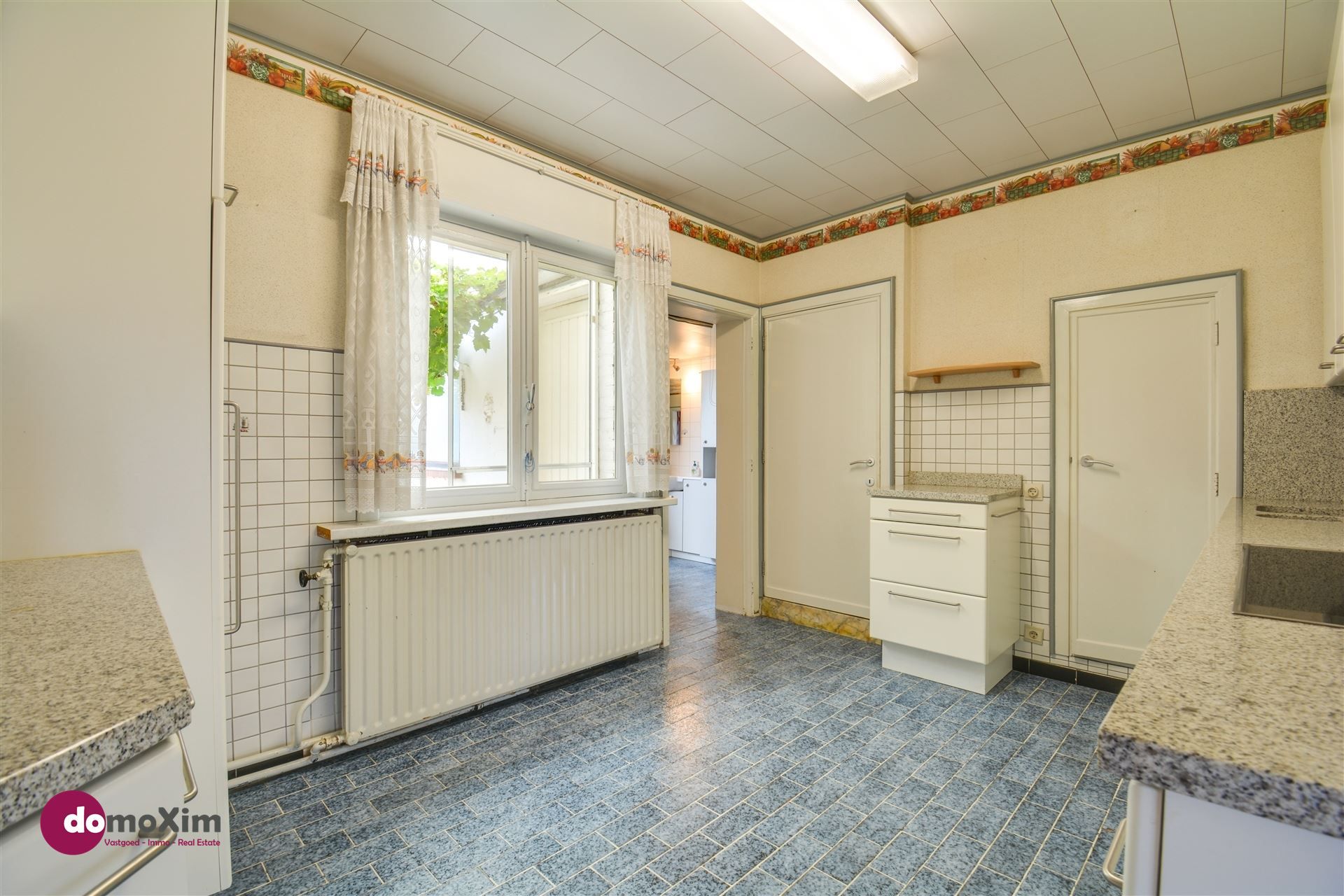 Charmante te renoveren woning met tuin op toplocatie in Boortmeerbeek foto 12