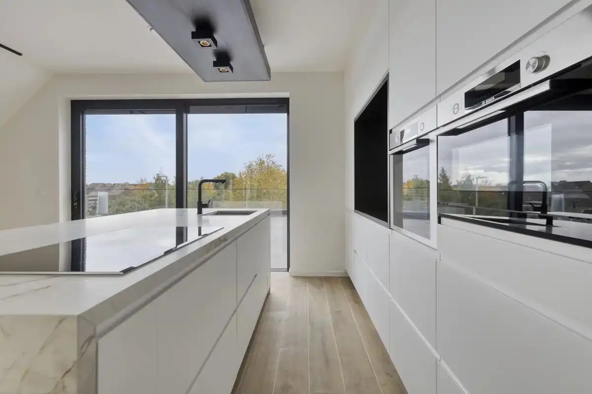 EXCLUSIEF EN KWALITATIEF NIEUWBOUWAPPARTEMENT VAN 163 M² MET 3 SLPK'S, 2 BADK'S EN RIANTE TERRASSEN IN MUNSTERBILZEN foto 9