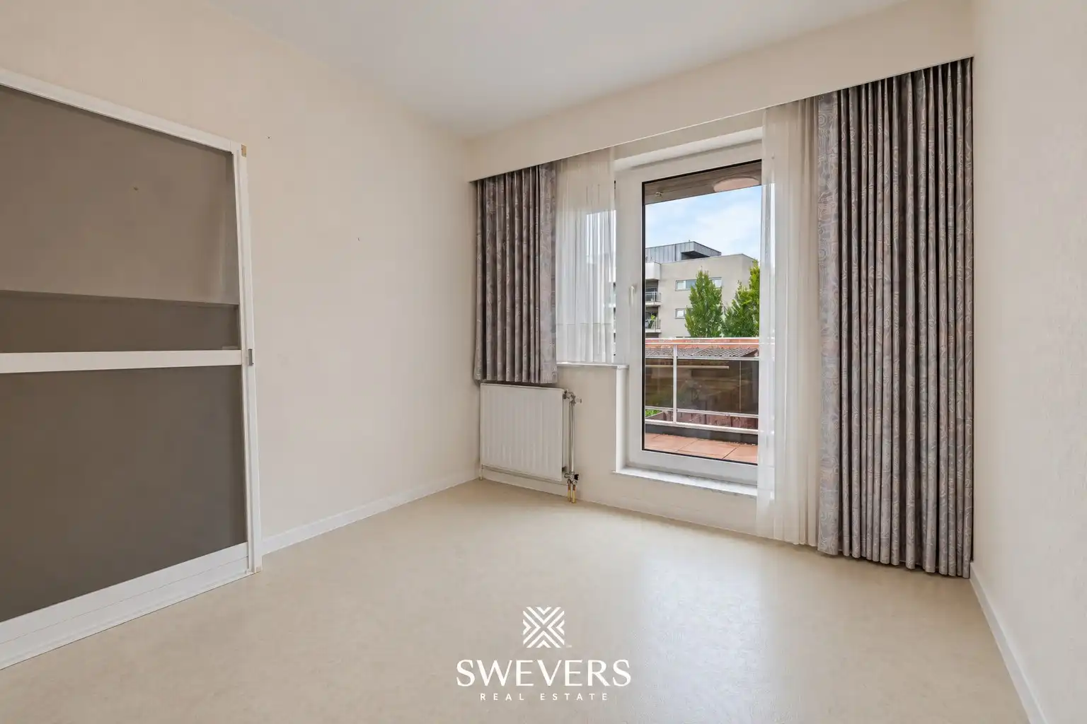 Ruim 2-slaapkamerappartement met groot terras en privéparking in centrum Beringen foto 16