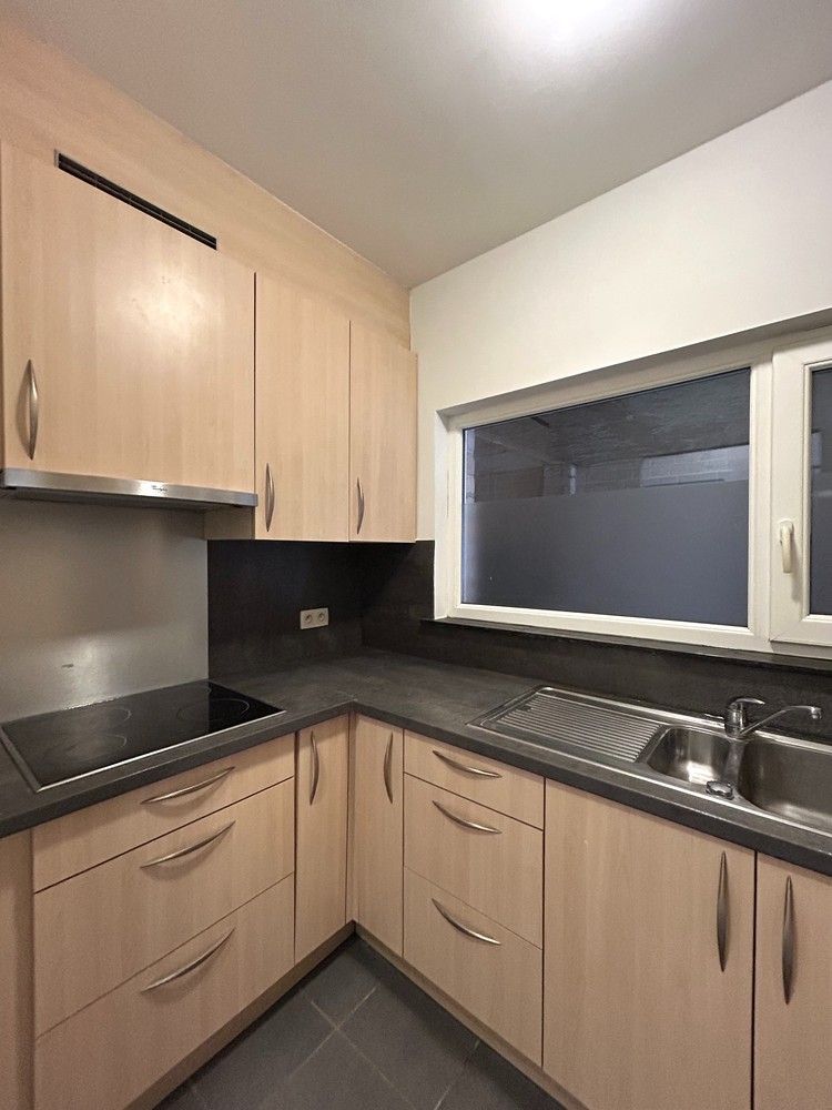 Instapklaar gelijkvloers 1-slaapkamerappartement met ruim terras in Leuven foto 7