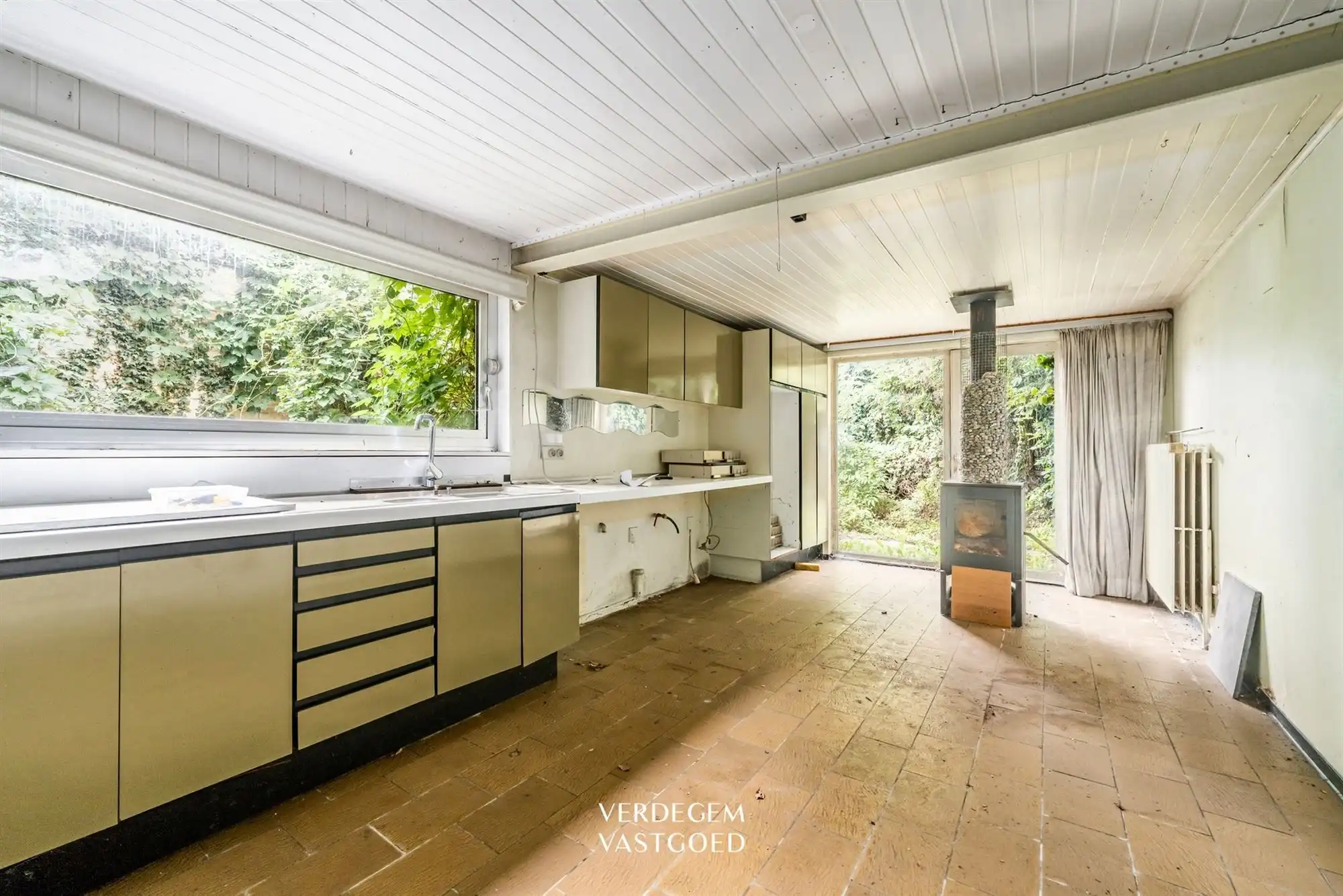 Renovatieproject: centraal gelegen handelspand met woonst en tuin foto 8